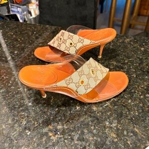 Gucci Leather Heel Sandals with Monogram and PVC straps.